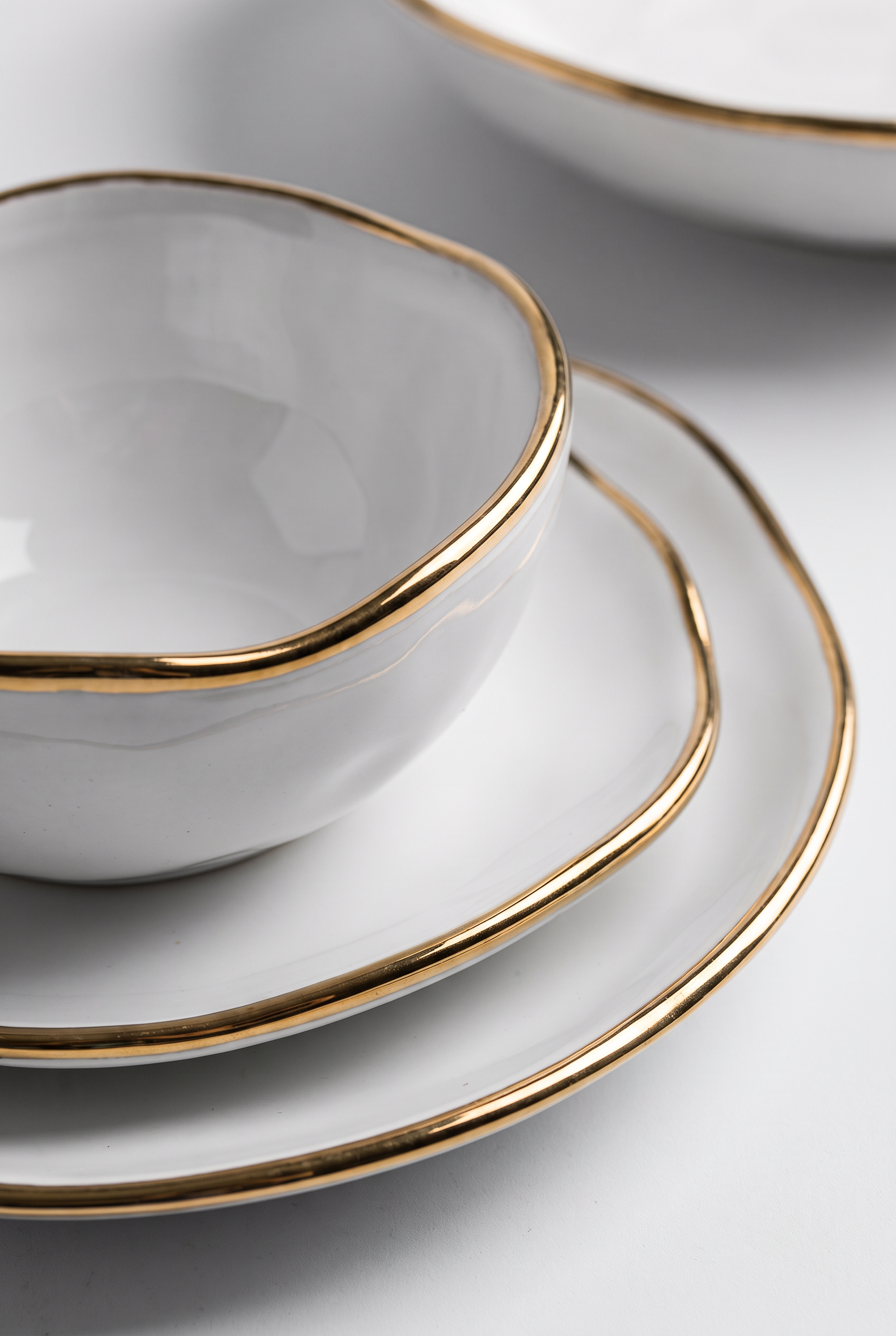 Ceramica White and Gold Dinnerware Set – angled product view