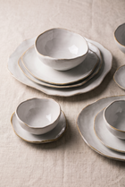 Ceramica White and Gold Dinnerware Set – in-use room view