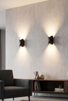 Luminara Adjustable Wall Sconce – lifestyle view in a styled setting