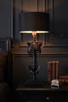 NecroLuxe Gothic Skeleton Table Lamp - in use on bedside console at night